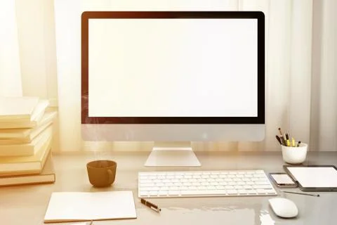 Front view of workpark with blank white computer screen, coffee cup, and book in Illustrazione stock
