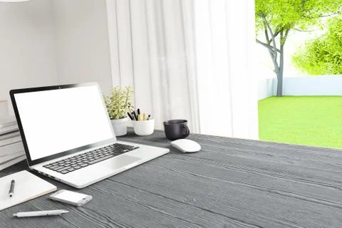 Front view of workpark with blank white computer screen, coffee cup, and book in Stock Photos