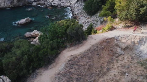 Front view of a young couple standing on top of mountain, embracing Stock Footage 130404914