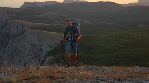 Front view of young man climbing mountain in countryside on autumn day spbd. Stock Footage 141839704