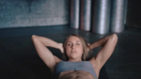 Front view of a young woman doing situps in gym Video stock 89848762