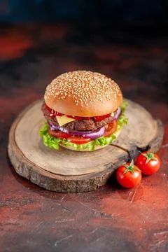 Front view yummy meat cheeseburger on dark background snack fast-food sandw.. Stock Photos