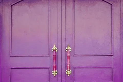 Front violet door, close up. Violet front door, close up. Wooden doors. Stock Photos