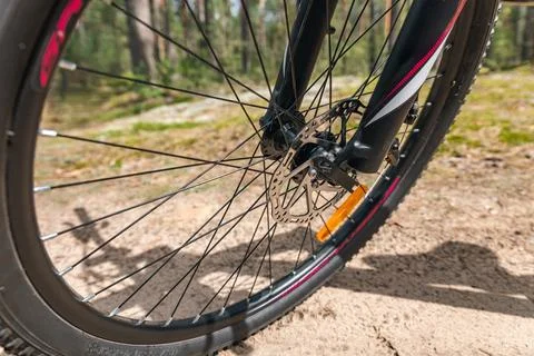 Front wheel of a bicycle, highlighting the disc brake system. Disc brakes o.. Stock Photos
