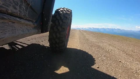 The front wheel of the buggy rides on a mountain road Stock Footage 161242207