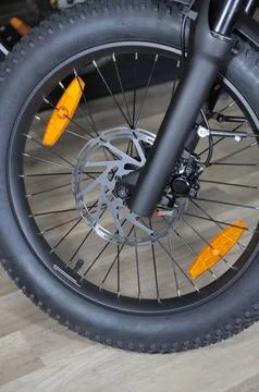 Front wheel of an electric bicycle with disc brake Stock Photos