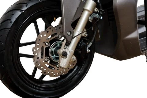Front wheel of a modern scooter with disc brake and suspension system isola.. Stock Photos