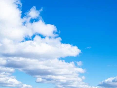 Front of white clouds in blue sky Stock Photos