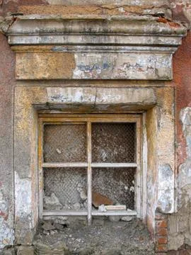 The front window of an old dilapidated house. Stock Photos