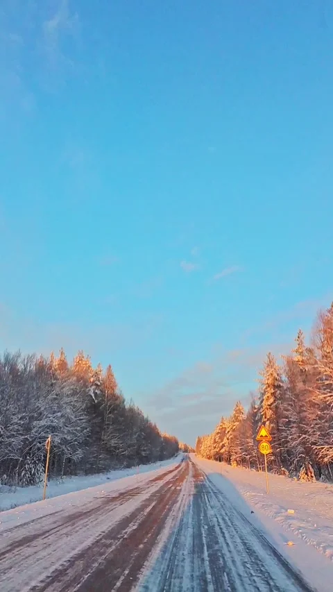 Front window point of view driving on snow covered winter road in Lapland w.. Stock Footage 341266284