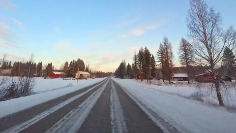 Front window point of view driving on snow covered winter road in Lapland w.. Stock Footage 341266396
