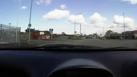 Front windscreen footage approaching a roundabout Stock Footage 247561278