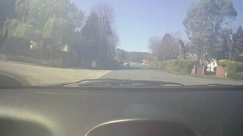 Front windscreen footage driving down side street in North Wales Stock Footage 247561414