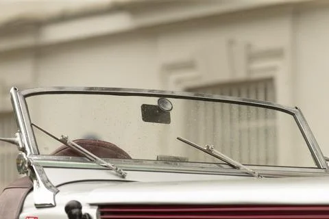 Front windshield and chrome trim of a classic convertible car Stock Photos