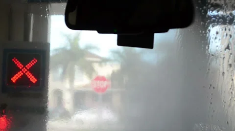 Front windshield on the carwash with red cross signal Stock Footage 34630304