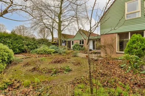 The front yard of a house with a green yard Stock Photos