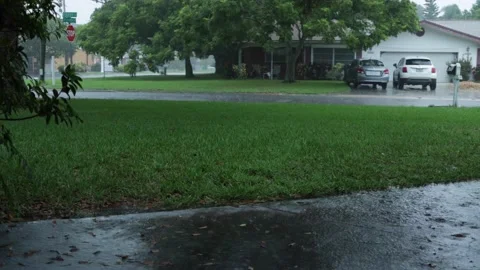 Front yard walking path during heavy rain and thunderstorm Stock Footage 138518298