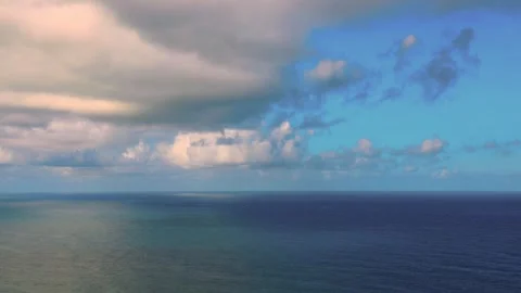 In front of you, billowing, ever-changing clouds fly across the vast sea. Stock Footage 260239534