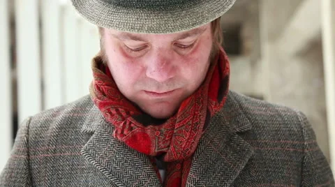 Frontal close up of man with the hat, coat and red scarf Stock Footage 47930861