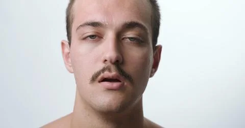 Frontal Close-Up Studio Portrait of Exhausted Young Man Sweating from Extre.. 스톡 사진
