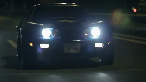 Frontal shot of Corvette with headlights turned on Stock Footage 33003131