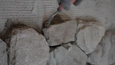 Frontal shot grout mortar on stone installed on wall Stock Footage 341636874