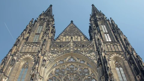Frontal tilt up view of facade of ancient gothic church St Vitus cathedral in Stock Footage 97912067