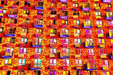Frontal view of the facade of the building with many windows. Changed color s Ilustración de archivo