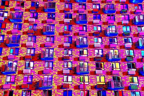 Frontal view of the facade of the building with many windows. Changed color s Ilustración de archivo