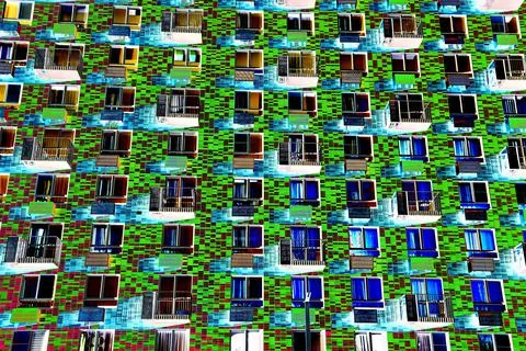 Frontal view of the facade of the building with many windows. Changed color s Ilustración de archivo