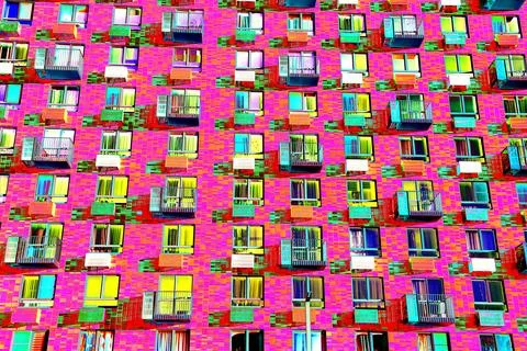 Frontal view of the facade of the building with many windows. Changed color s Ilustración de archivo