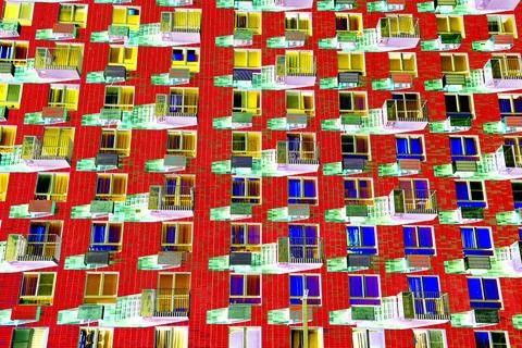 Frontal view of the facade of the building with many windows. Changed color s Ilustración de archivo