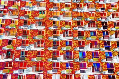 Frontal view of the facade of the building with many windows. Changed color s Ilustración de archivo