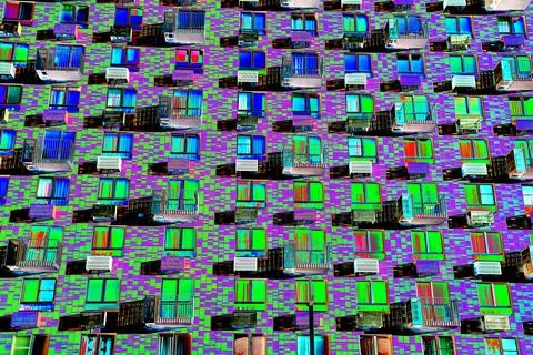 Frontal view of the facade of the building with many windows. Changed color s Ilustración de archivo