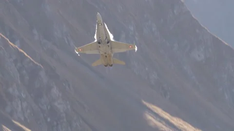 Frontal view of fighter airplane in flight pulling up and releasing bright flare Stock Footage 223498495
