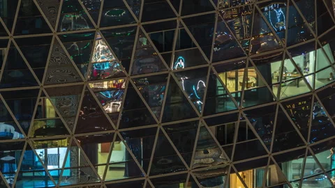 Frontal view of night facade of apartment building with a lot of windows with Stock Footage 254110214