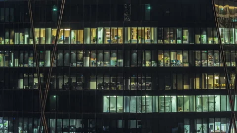 Frontal view of night facade of building with a lot of windows with light Stock Footage 271356462