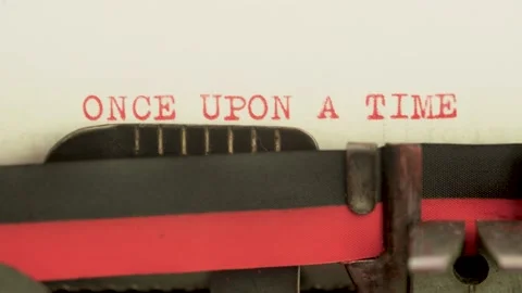 Frontal view typing text "once upon a time" on a old typewriter, red color 動画素材 155355743
