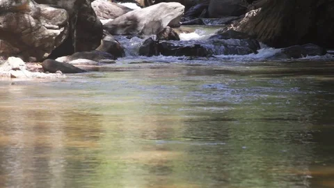 Frontal view of a waterfall with calm waters 動画素材 104310430