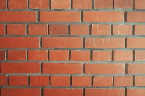 A frontally removed red brick wall. Textured background Stock Photos