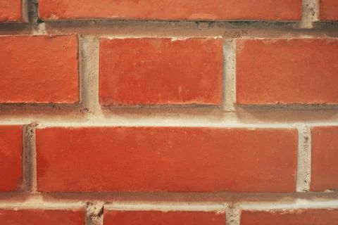A frontally removed red brick wall. Textured background Stock-Fotos