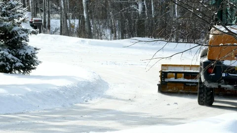 Frontend loader with attached blade removes snow from street after blizzard. Stock Footage 104061616