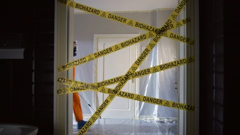 Frontline Worker in Full Hazmat Suit Enters Coronavirus Contaminated Room Stock Footage 129188529
