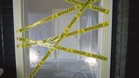 Frontline Worker in Full Hazmat Suit Enters Coronavirus Contaminated Room Stock Footage 129190363