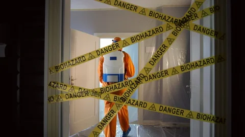 Frontline Worker in Full Hazmat Suit Enters Coronavirus Contaminated Room Stock Footage 129191566