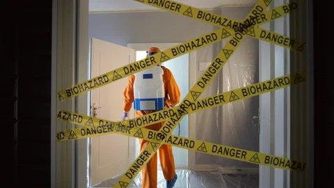 Frontline Worker in Full Hazmat Suit Enters Coronavirus Contaminated Room Stock Footage 129191744