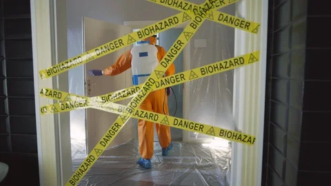 Frontline Worker in Full Hazmat Suit Enters Coronavirus Contaminated Room Stock Footage 129192196