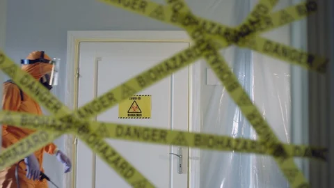 Frontline Worker in Full Hazmat Suit Enters Coronavirus Contaminated Room Stock Footage 129193701