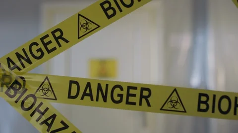 Frontline Worker in Full Hazmat Suit Enters Coronavirus Contaminated Room Stock Footage 129195705
