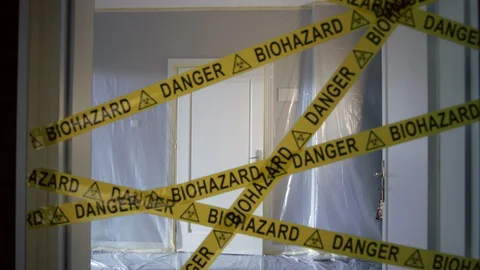 Frontline Worker in Full Hazmat Suit Leaves Coronavirus Contaminated Room Stock-Footage 129198600